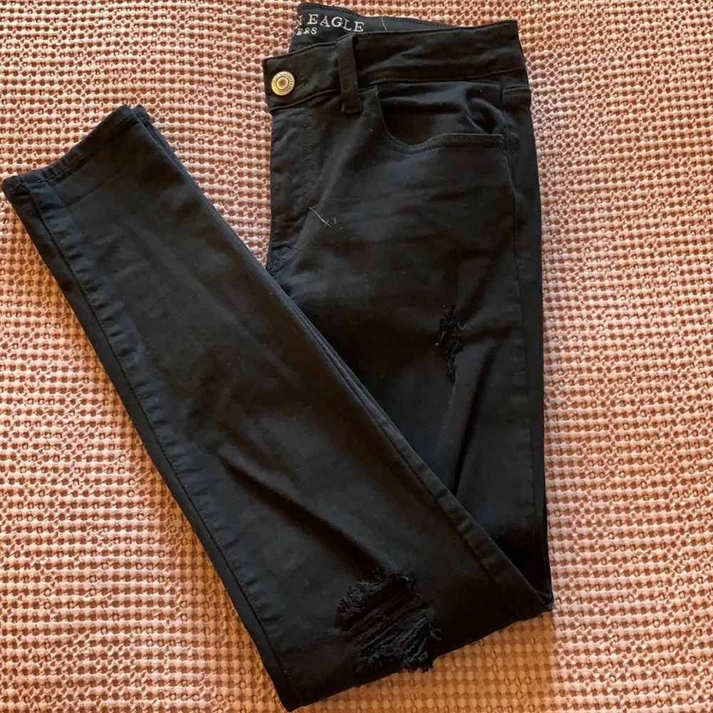 Black skinny jeans with holes